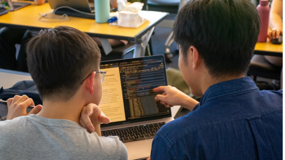 students looking at computer