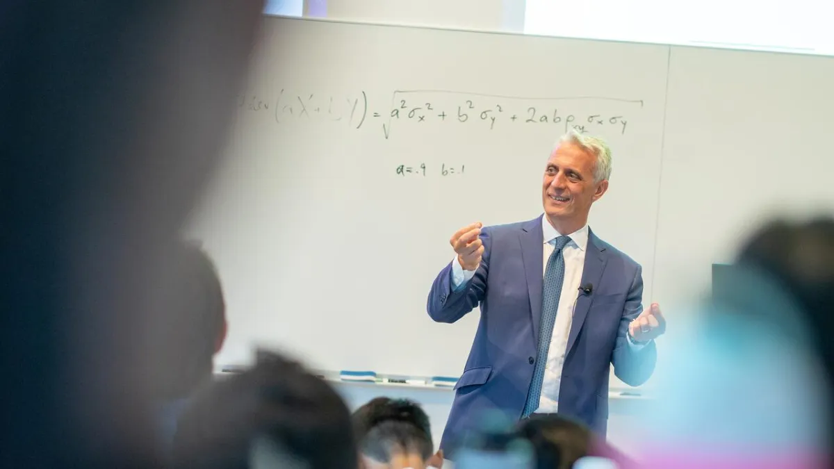 Dean Maglaras in front of whiteboard