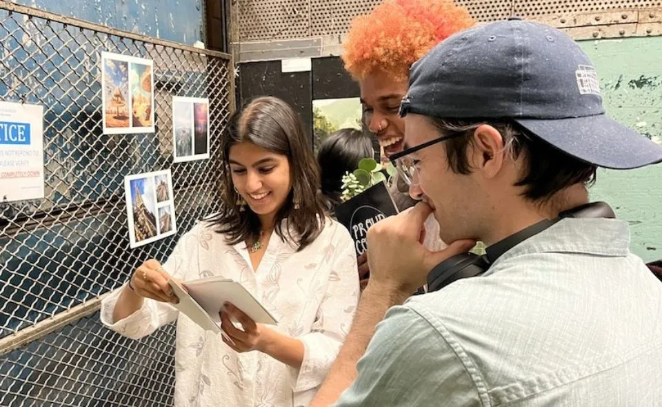 Art students examining photos 