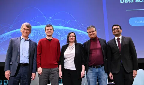 Five panelists onstage