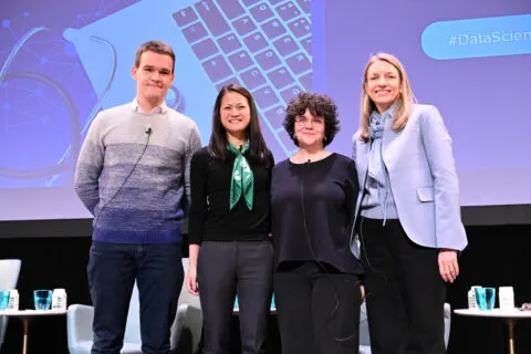 Panelists lined up for a posed photo after event