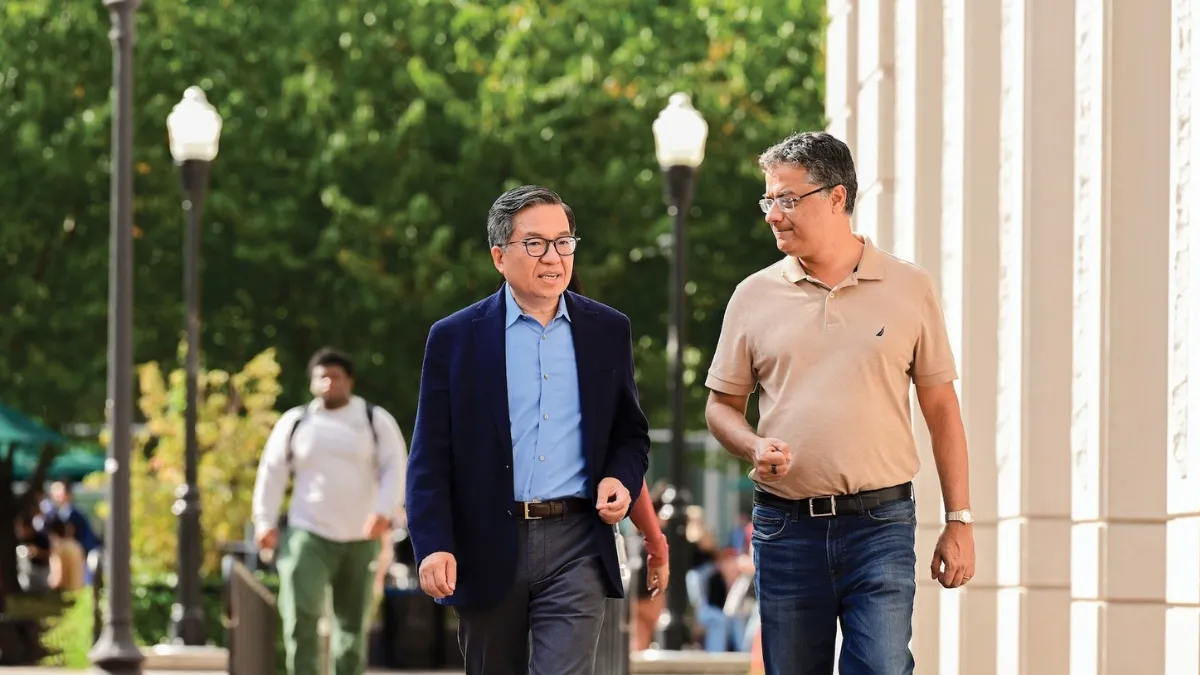 Columbia Engineering School Dean Shih-Fu Chang and Vice Dean Vishal Misra talking on Morningside Campus