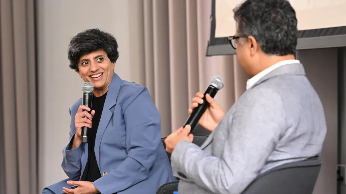 Two people discussing AI and the human side of sports.