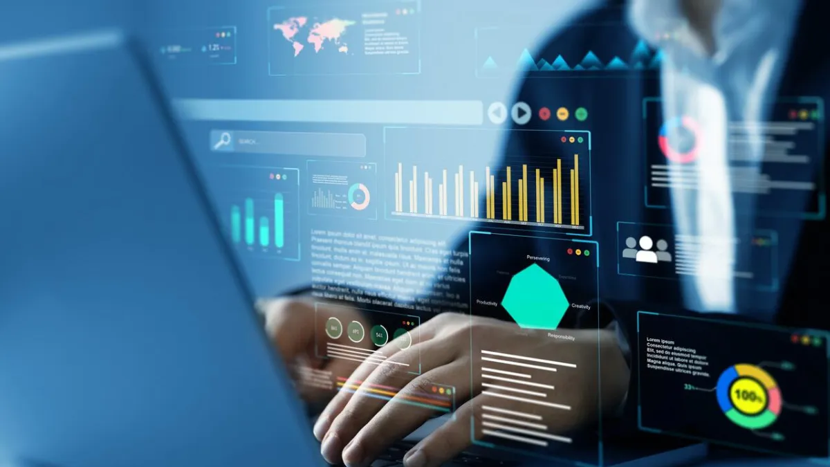 This image shows a person working on a laptop with futuristic digital analytics, suggesting themes of AI, automation, and business intelligence.