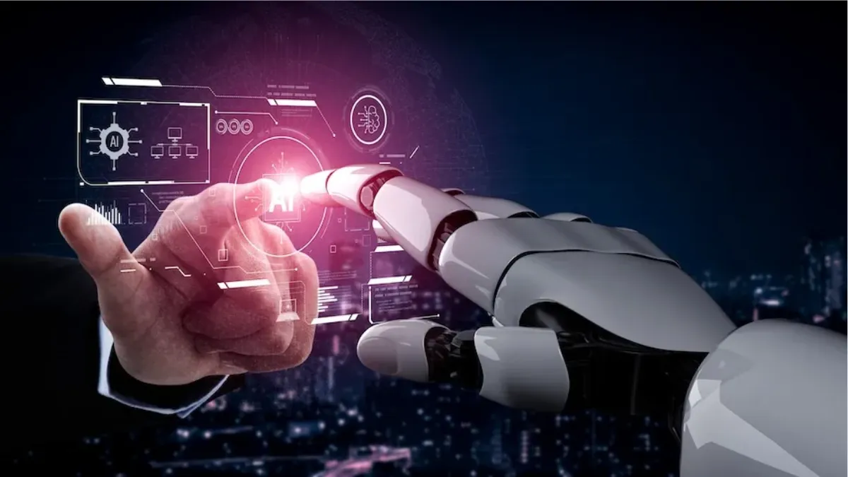 A human hand and a robotic hand reach toward each other, touching a glowing AI interface against a futuristic digital cityscape, symbolizing human–AI collaboration and technological advancement.