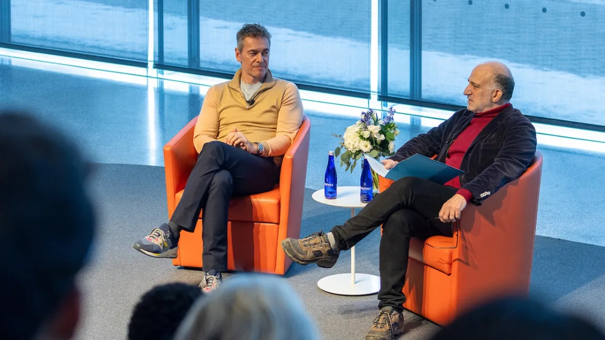 A picture of Warner Music Group CEO Robert Kyncl being interviewed 