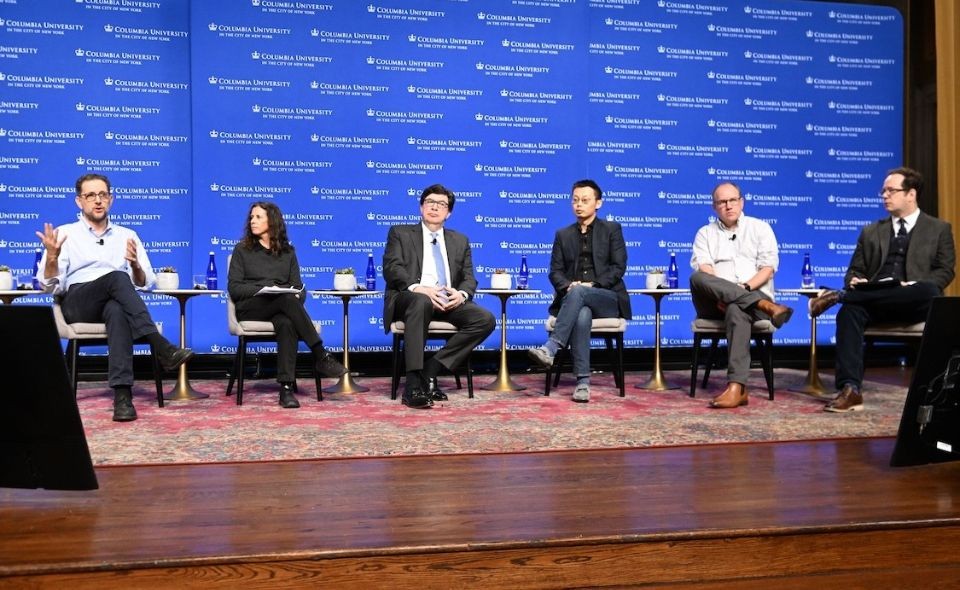 Six panelists onstage